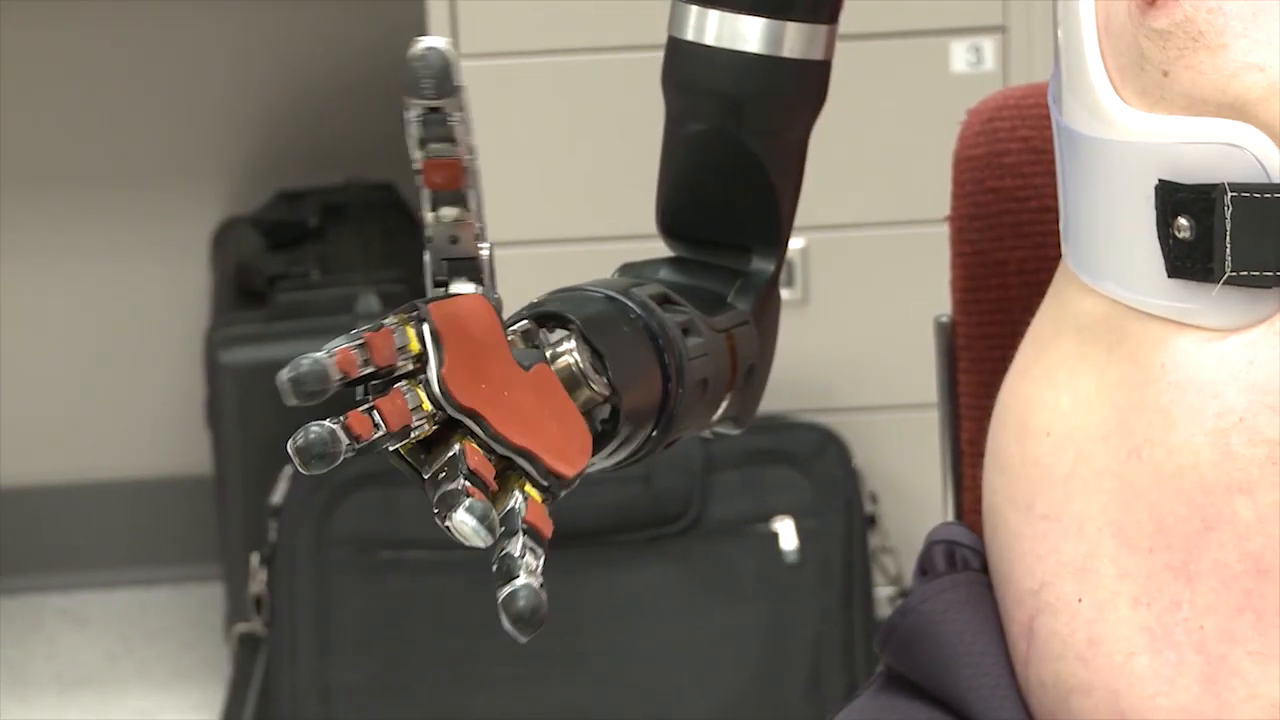 A close-up shot detailing the mechanical structure and articulation of the robotic hand's fingers. -