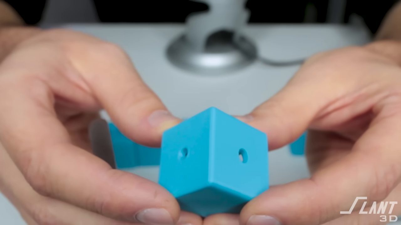 Hands holding blue cube object